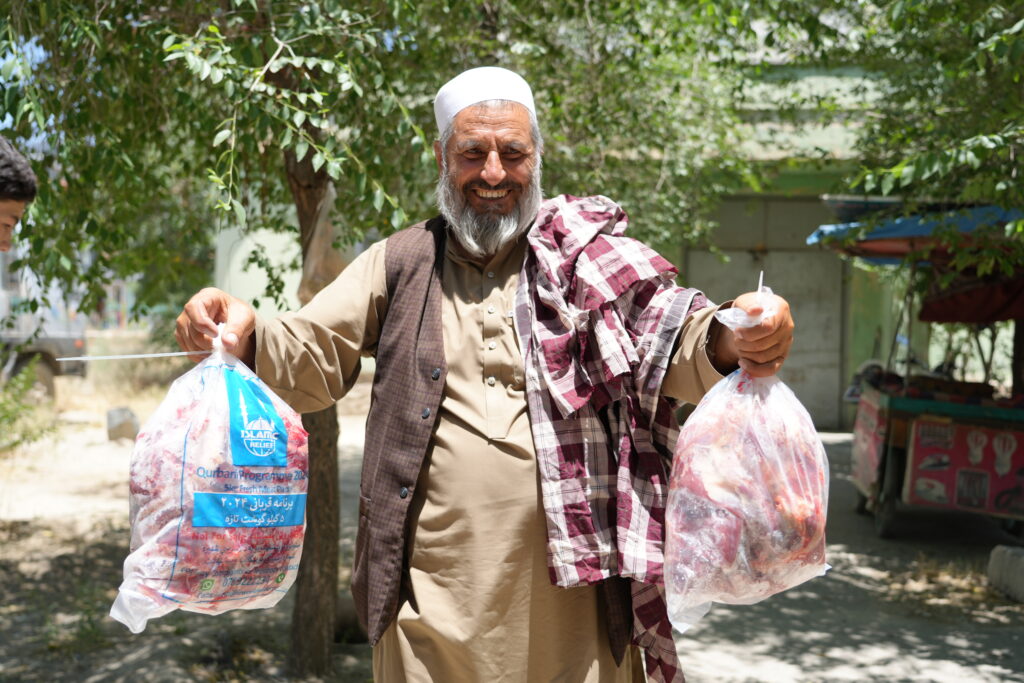 Man from Afghanistan holding  received Qurban meat from Islamic Relief for Eid Al-Adha in Dhul Hijjah