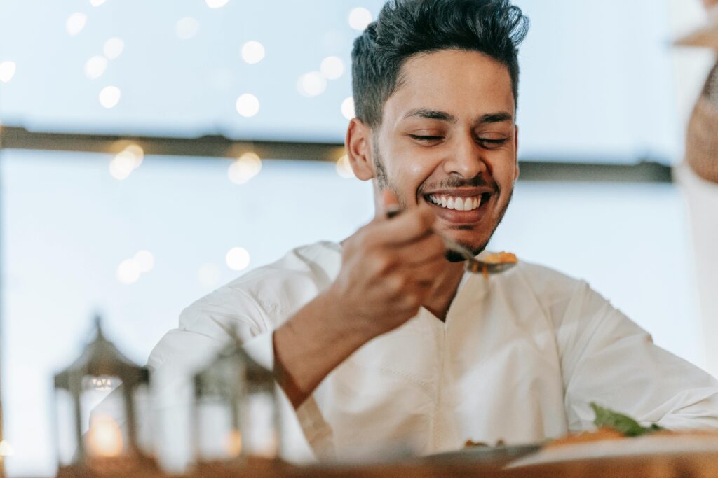 muslim man eating suhoor, an important aspect of fasting, especially during Ramadan