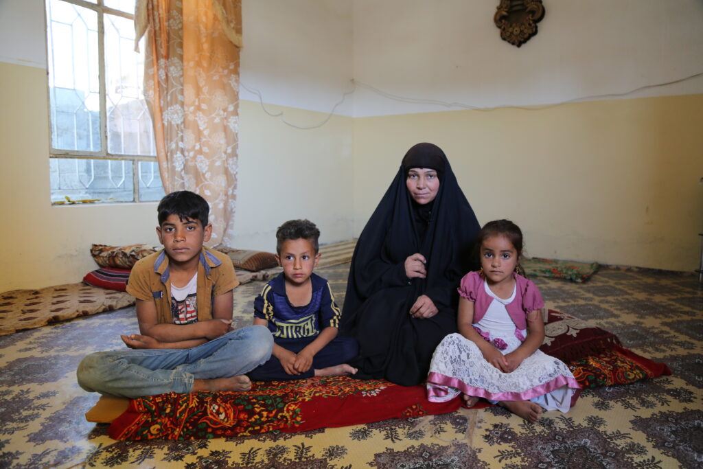 Um Muhammed and her children from Iraq, one of the recipients of the Ramadan food program.
