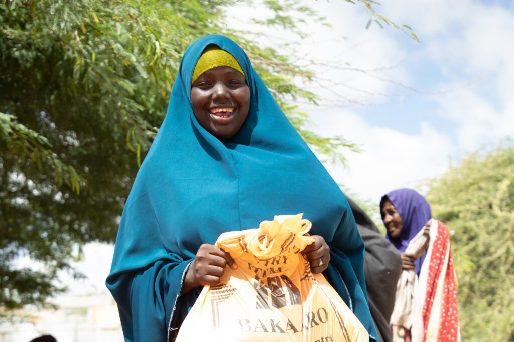 woman holding food pack