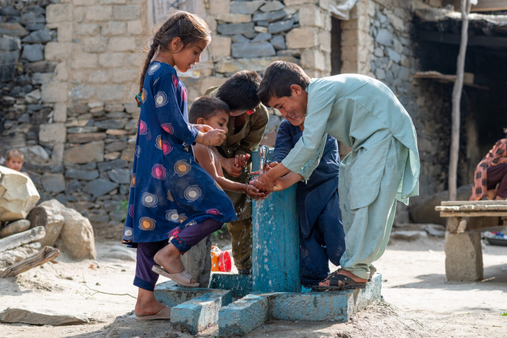 Children receiving water - a sadaqah jariyah