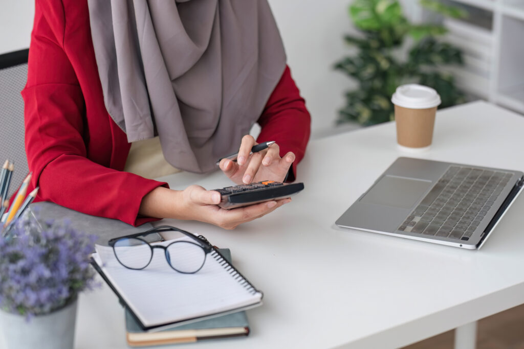 Woman managing EOFY donations and taxes